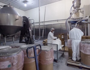 Vacuum conveying from floor level drums
