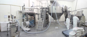 Vacuum conveying directly into tumble blenders