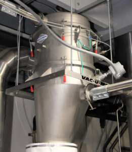 Closeup of the vacuum conveying system for San Juan Seltzer